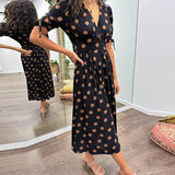 Caterina – Robe midi à pois col V effet sculptant