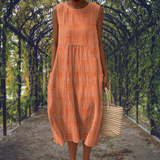 Amandine – Robe midi fluide sans manches avec poches