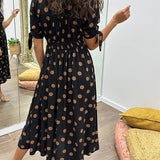 Caterina – Robe midi à pois col V effet sculptant