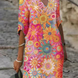 Nira – Robe midi fluide fleurie et élégante