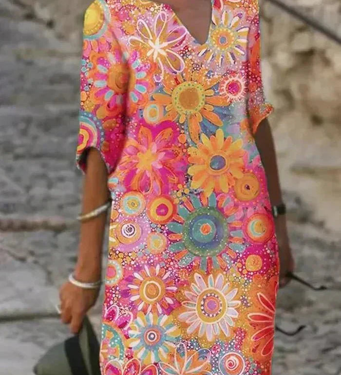 Nira – Robe midi fluide fleurie et élégante