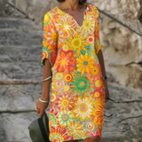 Nira – Robe midi fluide fleurie et élégante