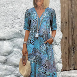 Véronique – Robe midi fluide élégante